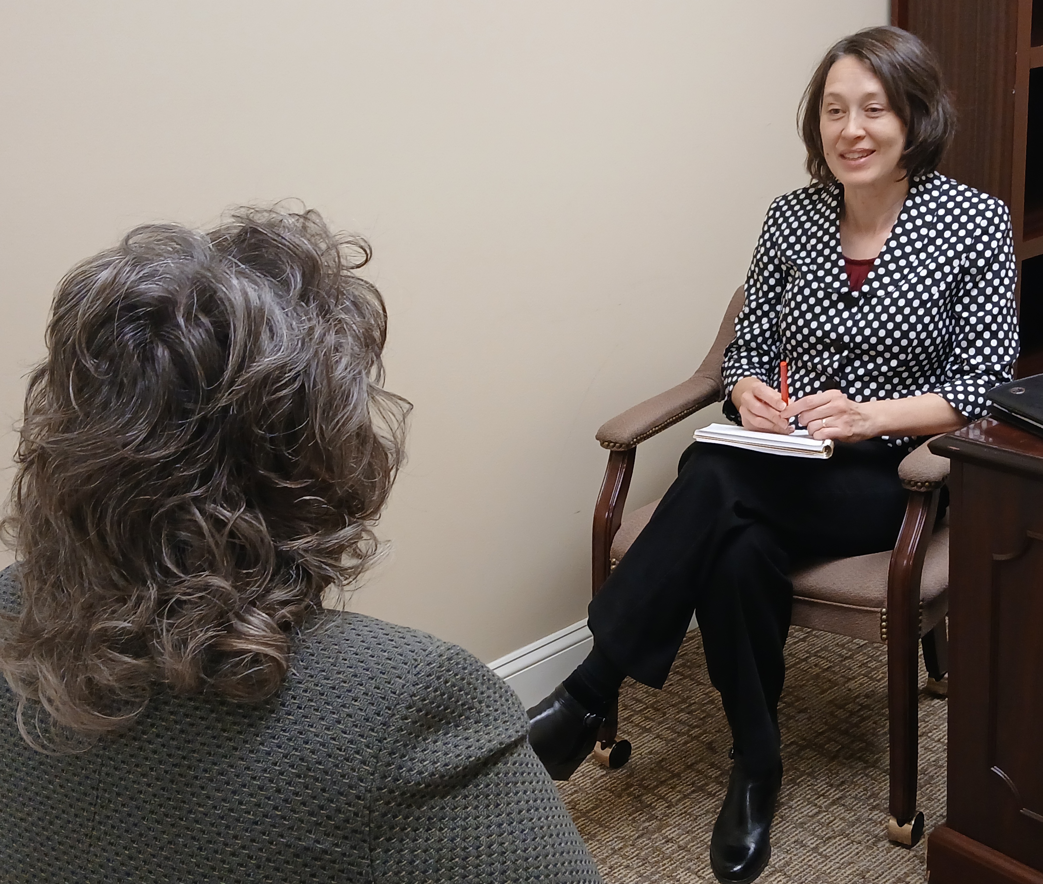 Jean coaching a leader one-to-one